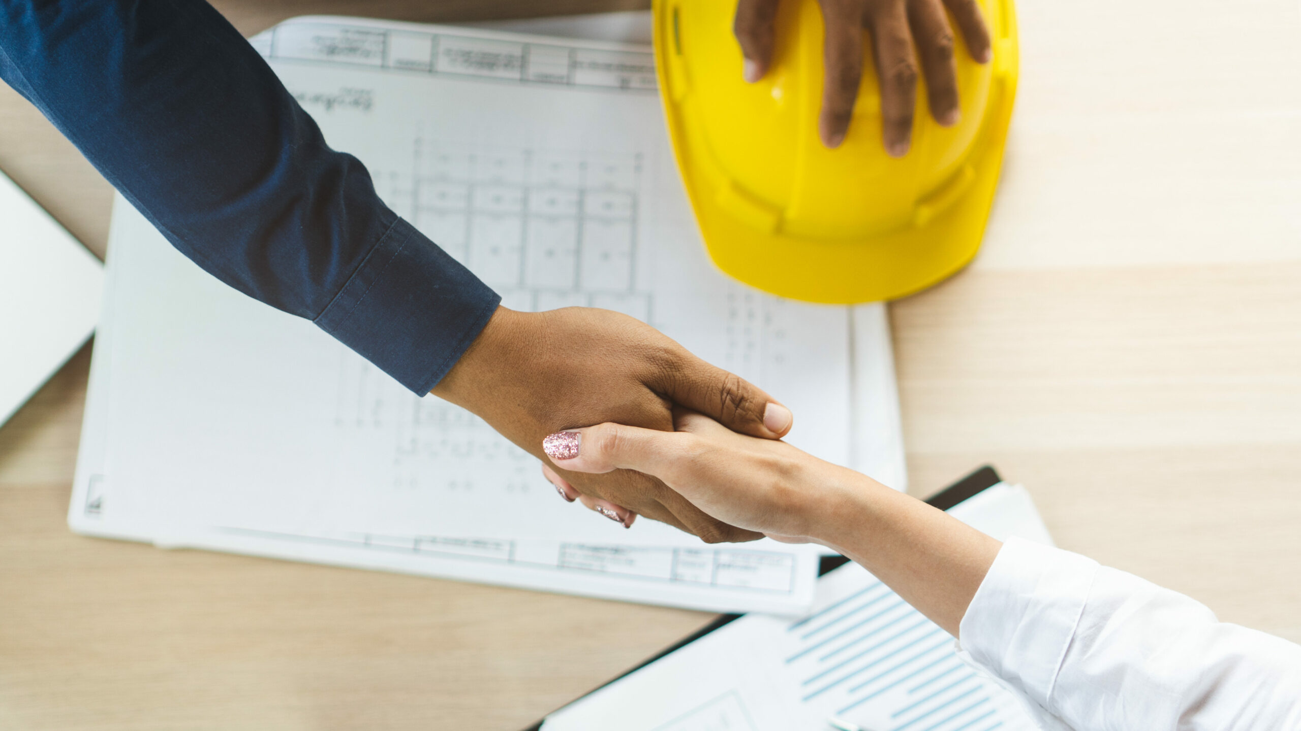 employer-funding - employers shaking hands after signing an agreement